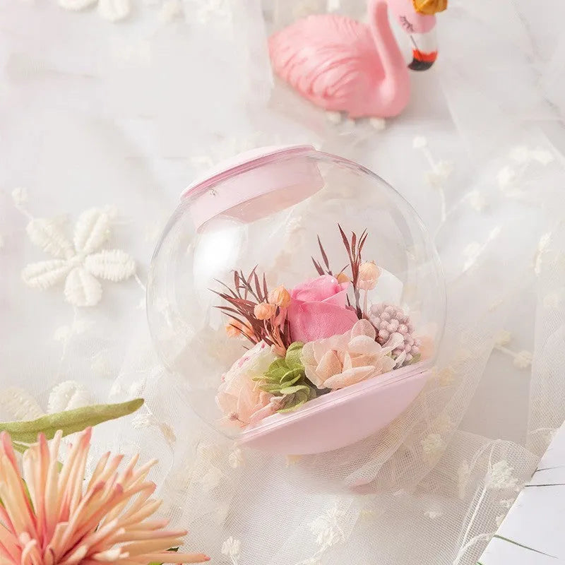 Pink preserved rose ornament with optional base and Bluetooth audio functionality for gift-giving