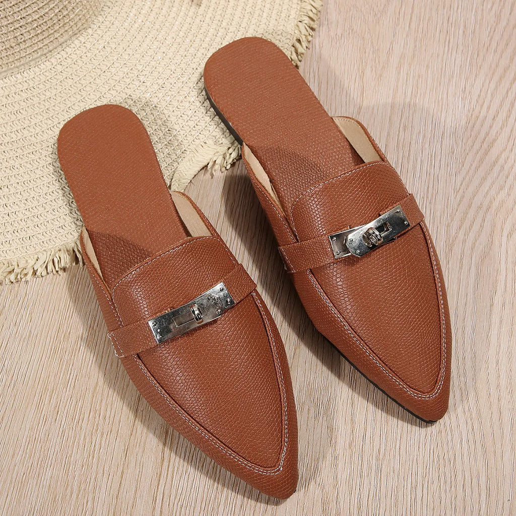 Light brown women's pointed-toe slippers with low heel design on white background