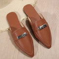 Light brown women's pointed-toe slippers with low heel design on white background