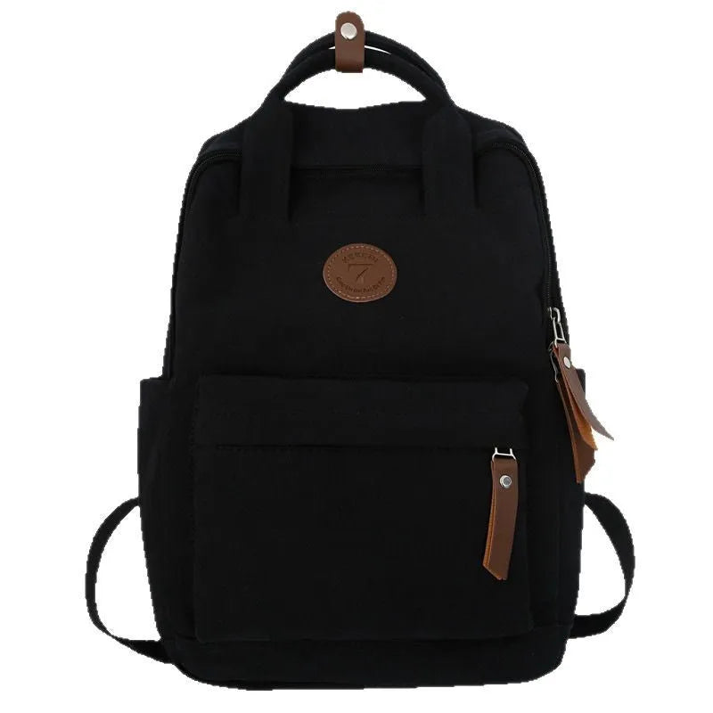 Black Oxford cloth unisex backpack with curved shoulder straps in an urban simplicity style.