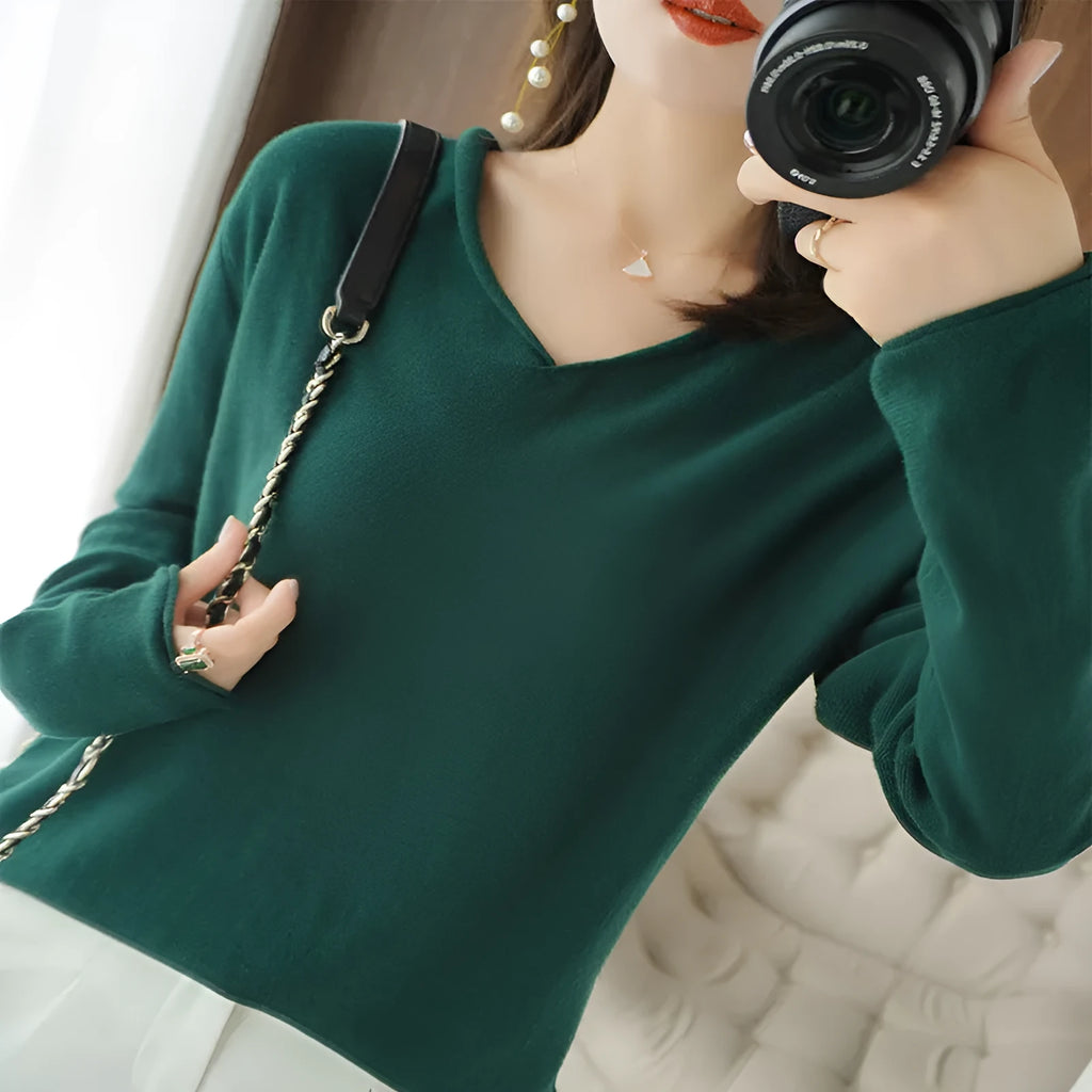 Women's V-neck long sleeve knitwear top in turmeric colour on a hanger