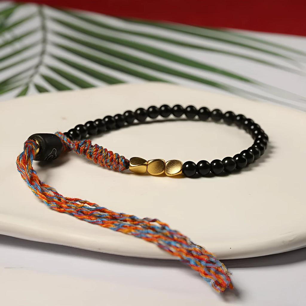 Hand-woven obsidian colour bracelet with 4mm width and 15.5-16cm length shown as wearable accessory