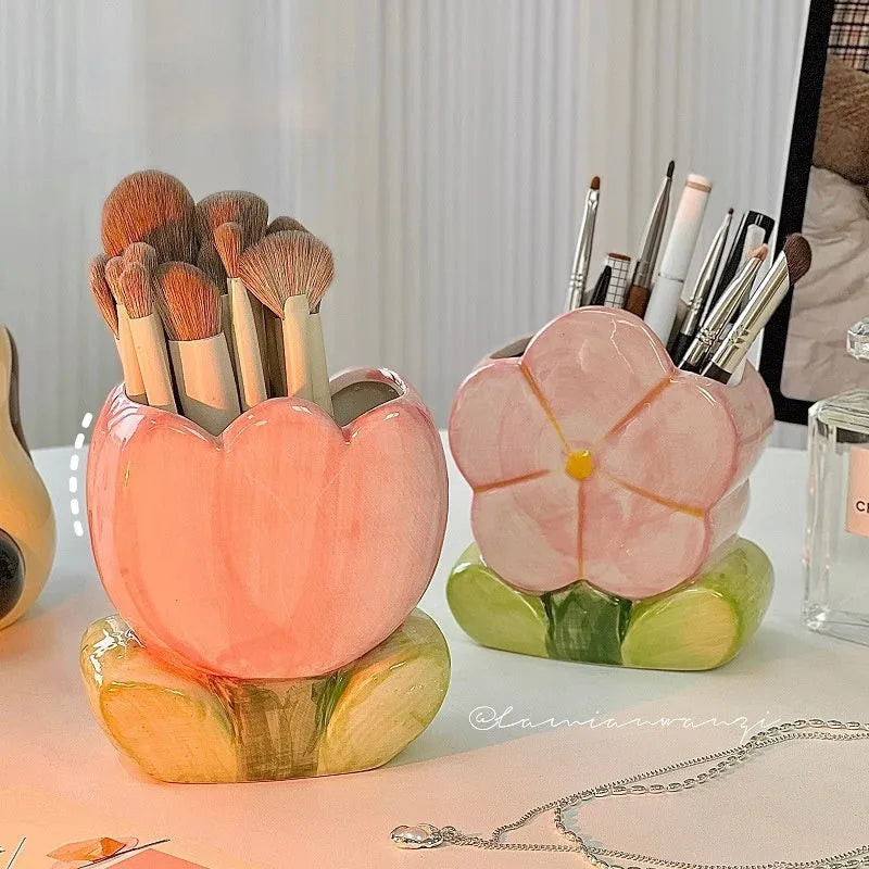 Ceramic desktop pen holder box with floral design in blue, pink, or purple.