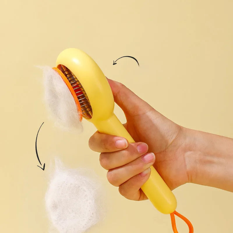 Yellow plastic pet grooming comb with open-section needle teeth for removing hair from cats and dogs.