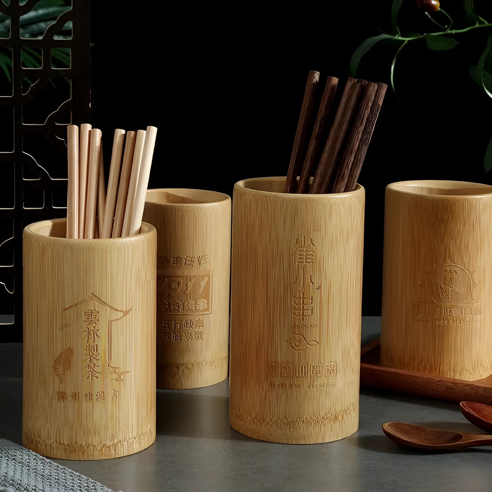 A natural bamboo tube chopsticks holder for multi-purpose storage on a wooden table.