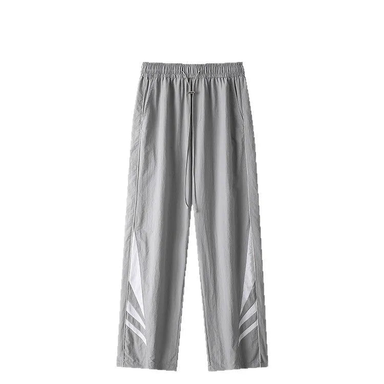 Men's straight leg casual trousers in grey, featuring an elasticated waistband and a loose fit.