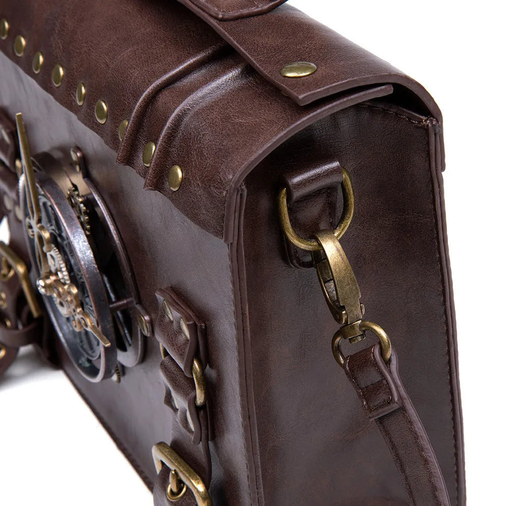Bronze steampunk pillow shoulder bag with metal hardware on a textured PU leather surface.