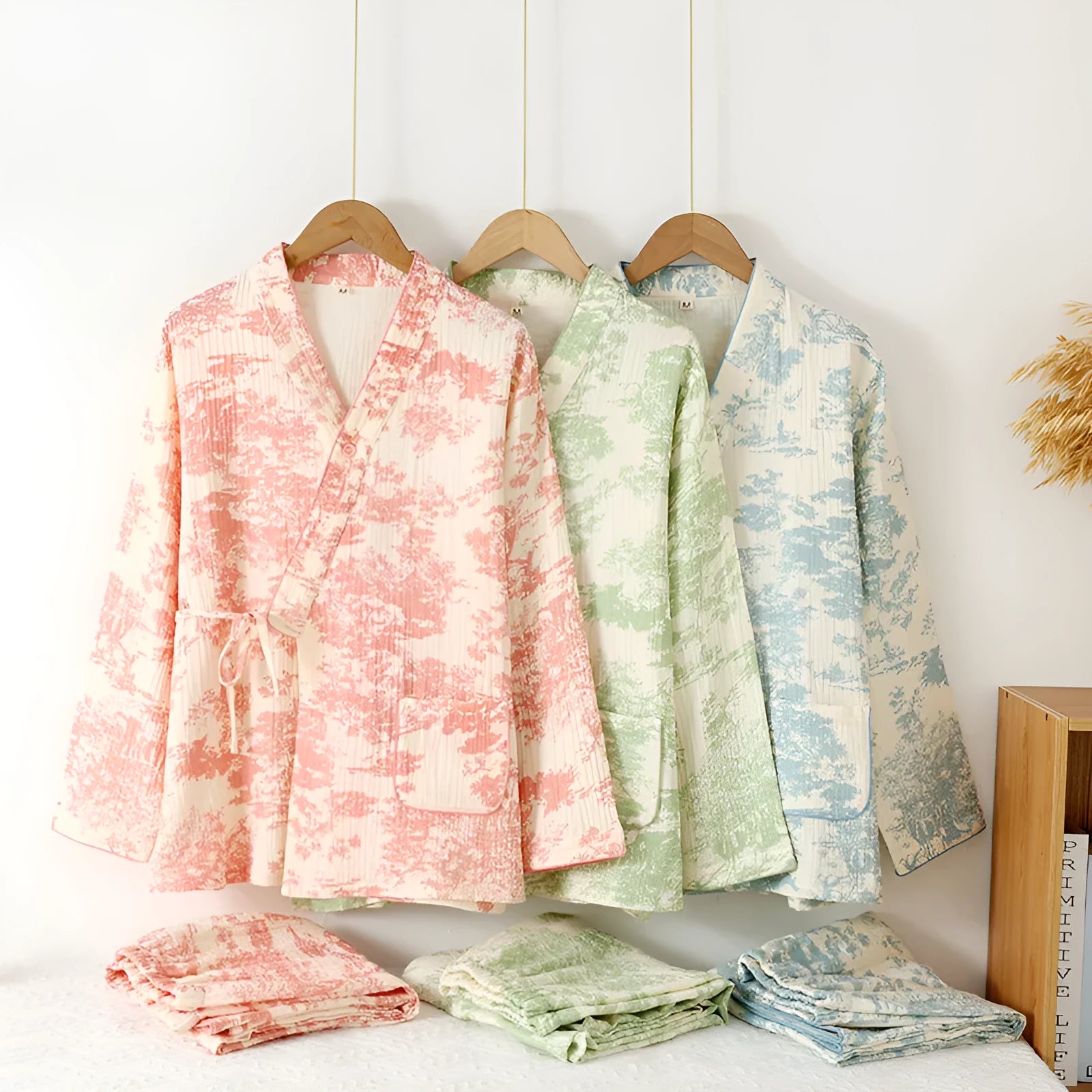 Women's cotton gauze loungewear set showing long sleeve shirt and matching trousers with lace-up detail in pastel colour