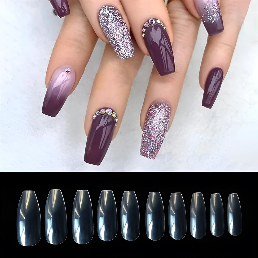 500 clear acrylic false nails in 10 sizes, made from ABS plastic, arranged on a table.