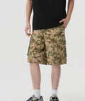 American style retro workwear loose camouflage shorts in cropped length on a neutral background.