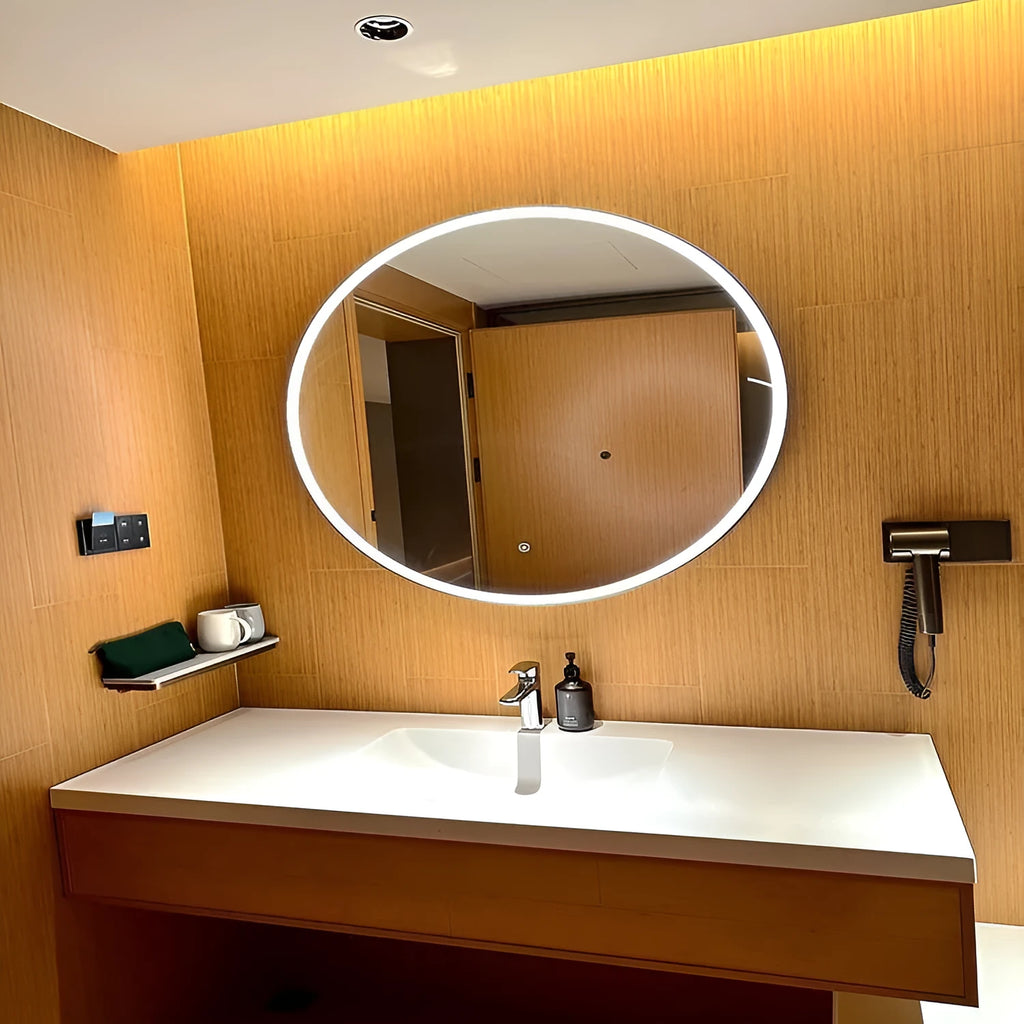 Round black aluminium frame wall mirror with integrated LED lighting around the edge.