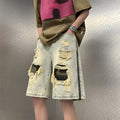 Men's yellow mud camouflage denim shorts with ripped detailing and straight-leg Korean cut