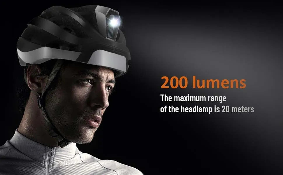 Smart black and grey cycling helmet with integrated warning lights showing USB charging port