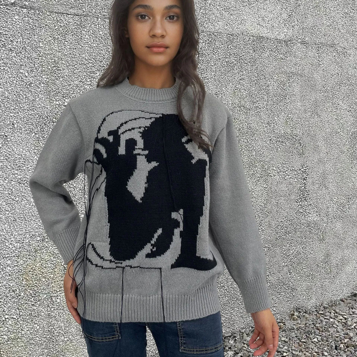 Women's loose fit alpaca wool sweater with tassel details and abstract pattern in street fashion style