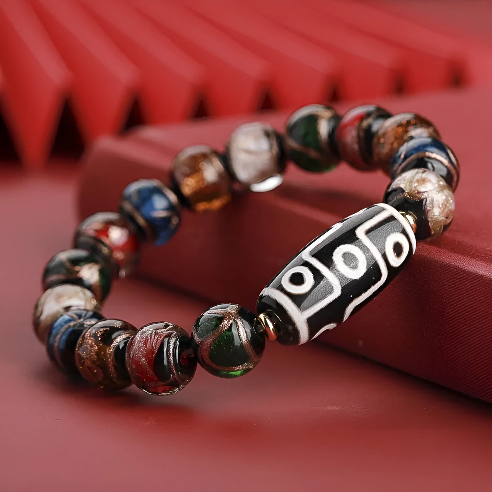 Traditional Chinese coloured glaze bracelet with year snake and lucky bead elements in ancient five-colour design