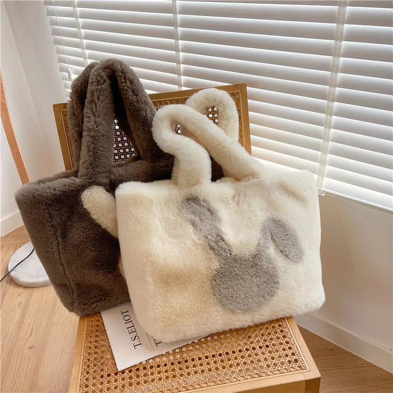 Cartoon rabbit ears design on a solid colour plush tote bag for women.