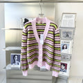 Pink Haima wool knitted cardigan sweater showing round neck pullover and cardigan styling options