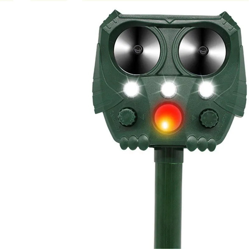 Green solar ultrasonic animal repeller unit showing dimensions and outdoor installation.