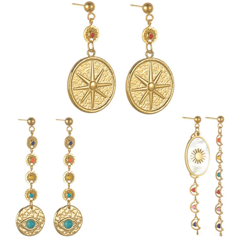 Stainless steel geometric drop earrings showing three designs: eight awn star, eye shape, and shell sun pattern