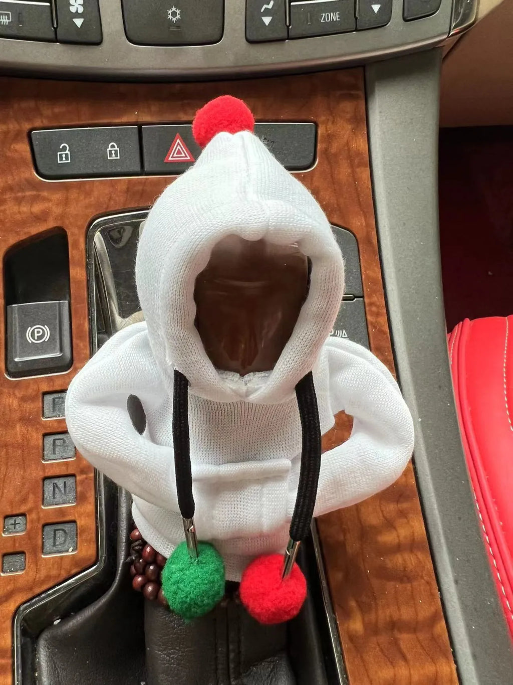 Santa Claus car gear lever cover in black or pink fabric with hooded sweatshirt design, fitting gear shift knob and handbrake.