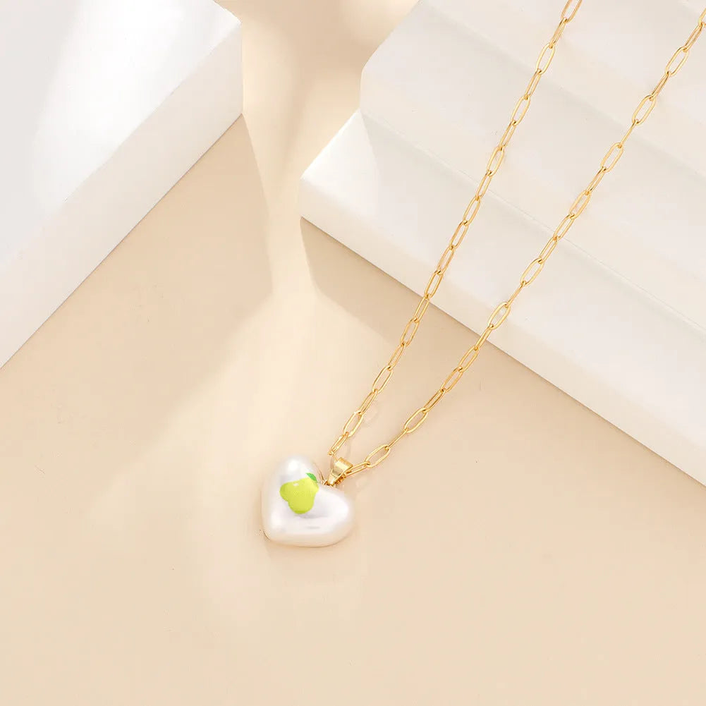 Girl's adjustable necklace with a heart and geometric fruit charms on a chain