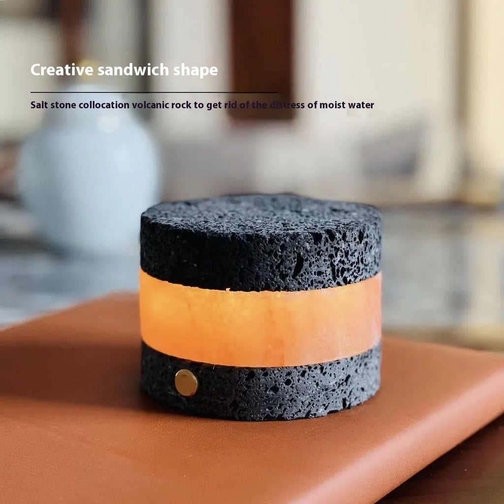 Small orange volcanic rock touch night lamp with USB port and essential oil reservoir.