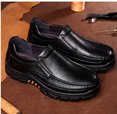 Men's black and brown cowhide leather slip-on business casual shoes with rubber sole.