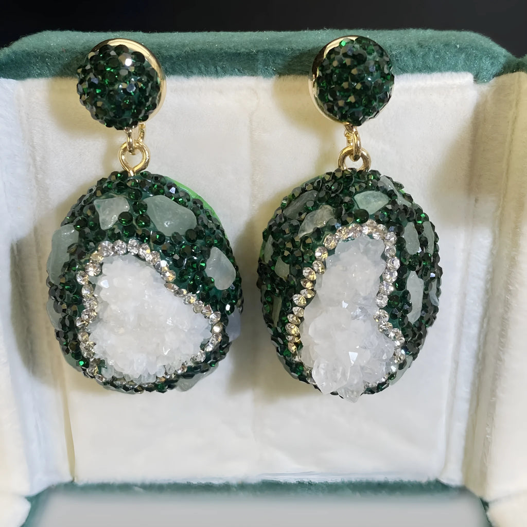 Crystal Bud Inlaid Emerald Earrings in dark green with a copper geometric base and crystal bud detail on a white background