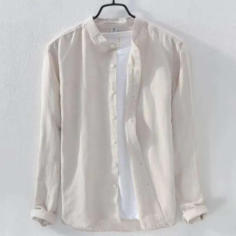 A man's loose fit long sleeve casual shirt in a cotton linen blend, shown in a solid colour.