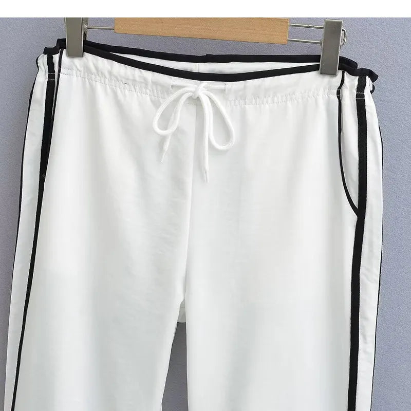 Women's loose straight trousers with ribbon parallel bars detailing in thin draping fabric