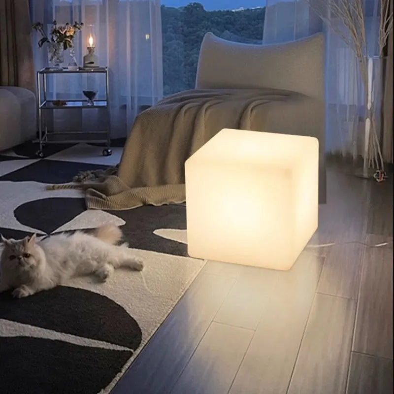 Modern square LED cube stool light for outdoor gardens, available in multiple sizes with solar or rechargeable power