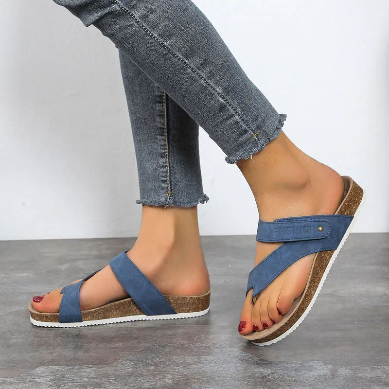 Flat thick-soled flip-flops with a toe ring strap in blue, showing artificial PU upper and foam sole.