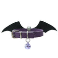 Black patent leather collar with attached metal devil wings and small bell charm.