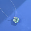 Women's silver pendant necklace with moissanite stone on an invisible fishing line chain.