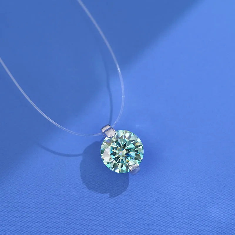 Women's silver pendant necklace with moissanite stone on an invisible fishing line chain.
