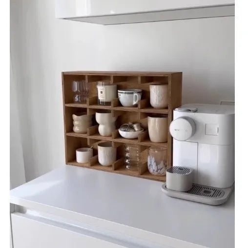 Square solid birch wood cup storage rack with multiple grid compartments in a natural meridian colour.