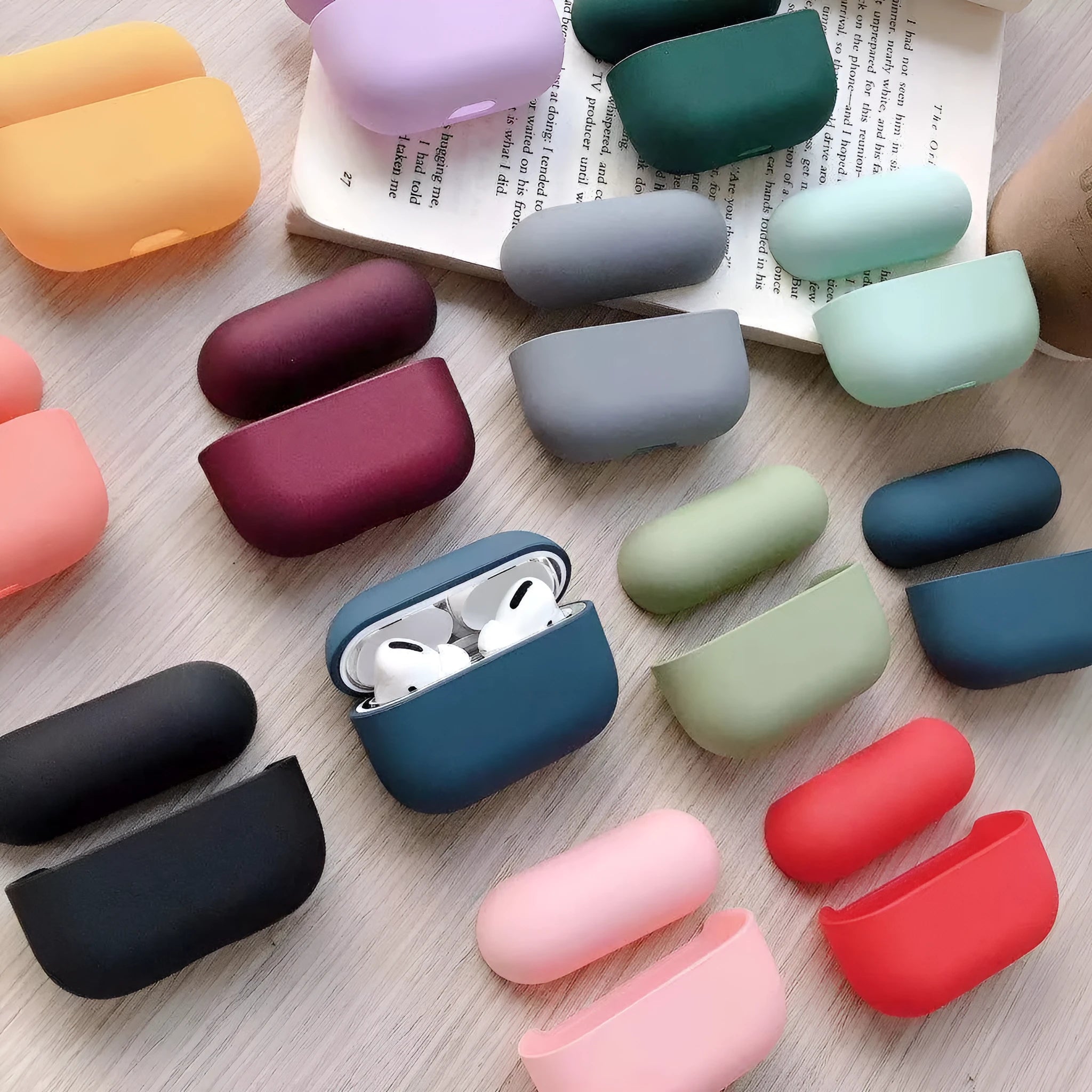 Plastic protective case for AirPods Pro headphones in various colours on a plain background
