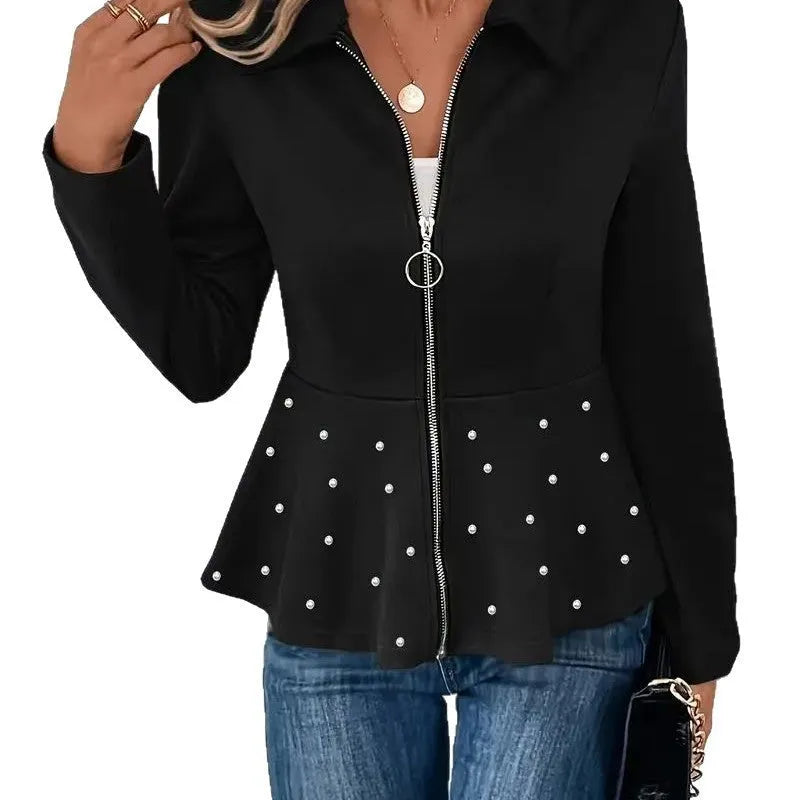 Women's loose fit black coat with beaded heavy-duty zipper and ruffled hem detail.