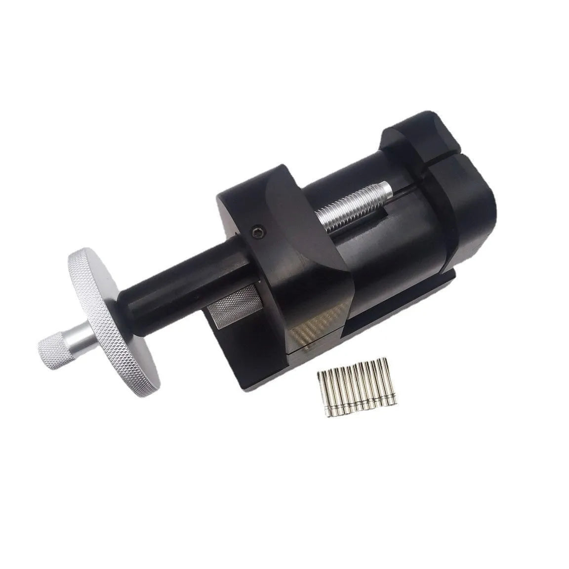 Alloy steel watch strap removal machine tool on a bench, showing compact size and components.