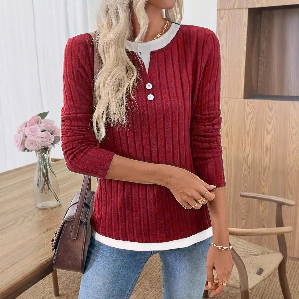 Women's fake two-piece round neck button pullover grinding sweater in concave stripe polyester.