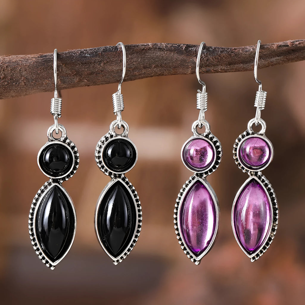 Pair of vintage geometric pendant earrings in black and purple zinc alloy with round retro design