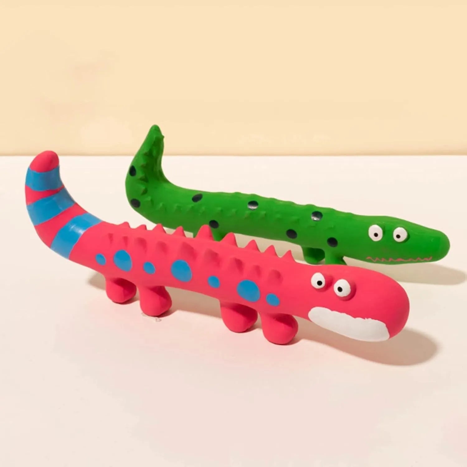 Green lizard-shaped dog chew toy with squeaker, measuring 24 cm long for aggressive chewers
