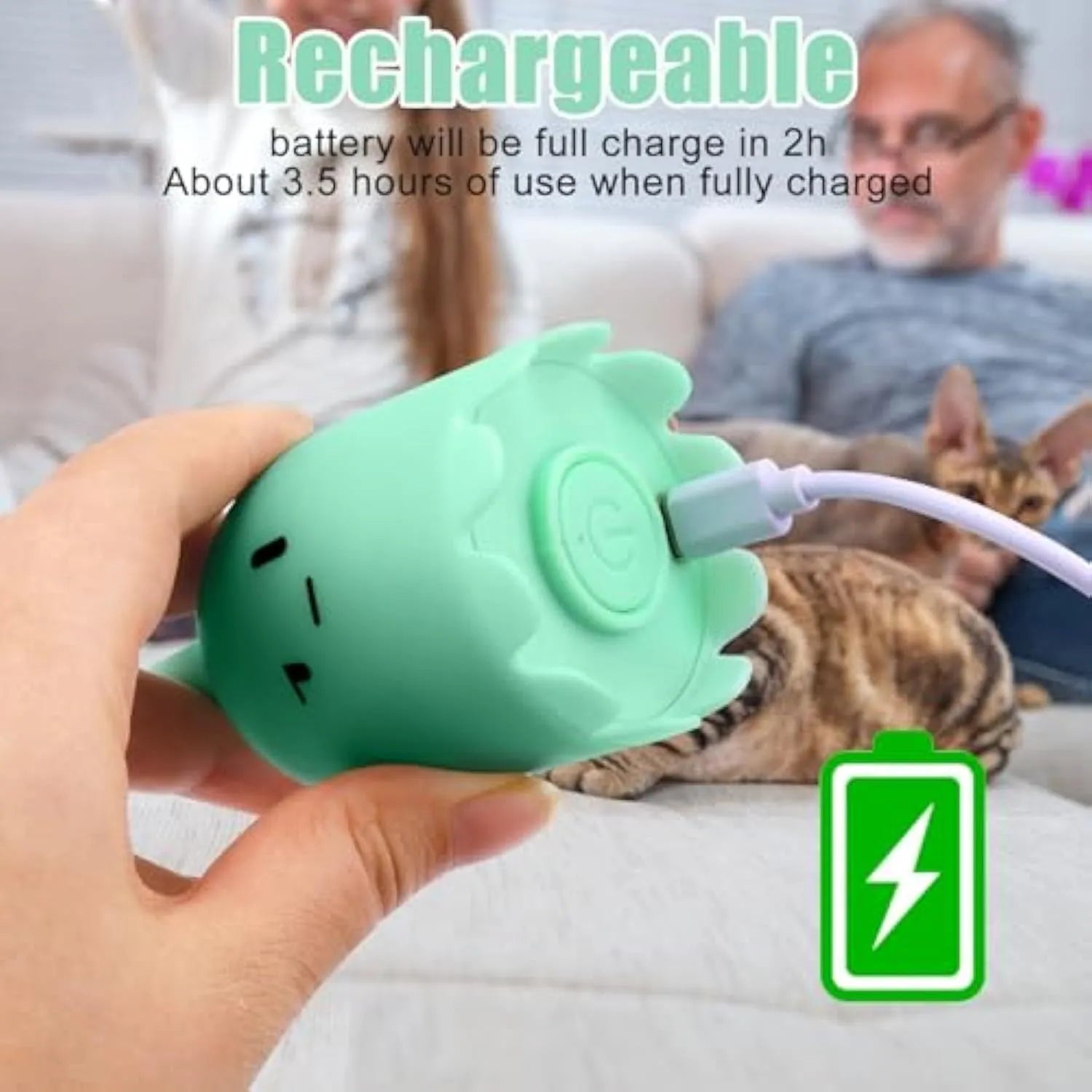 Green automatic electronic cat wand toy with swinging silicone tails on a table