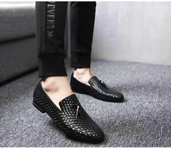 Anyaman men's woven loafers in black with soft sole, side view showing handcrafted weave texture