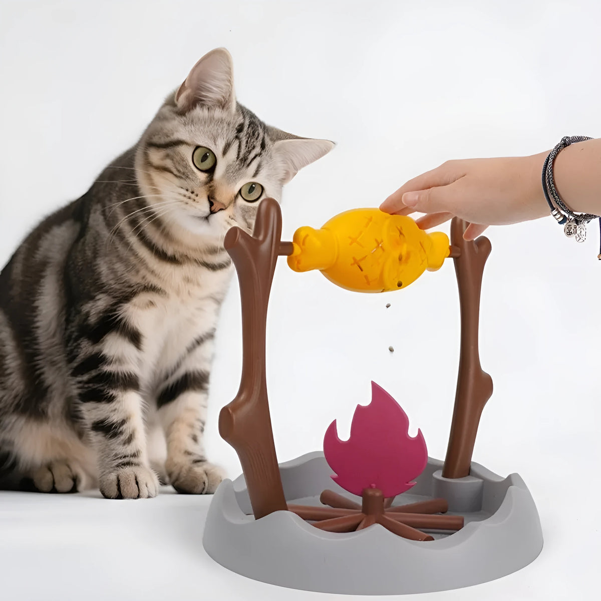 Barbecue-style tumbling cat feeder toy with leakage food compartments measuring 30cm cube