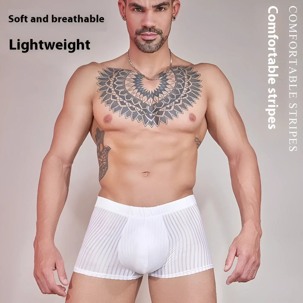 Men's black and white striped low-rise nylon briefs on a flat surface