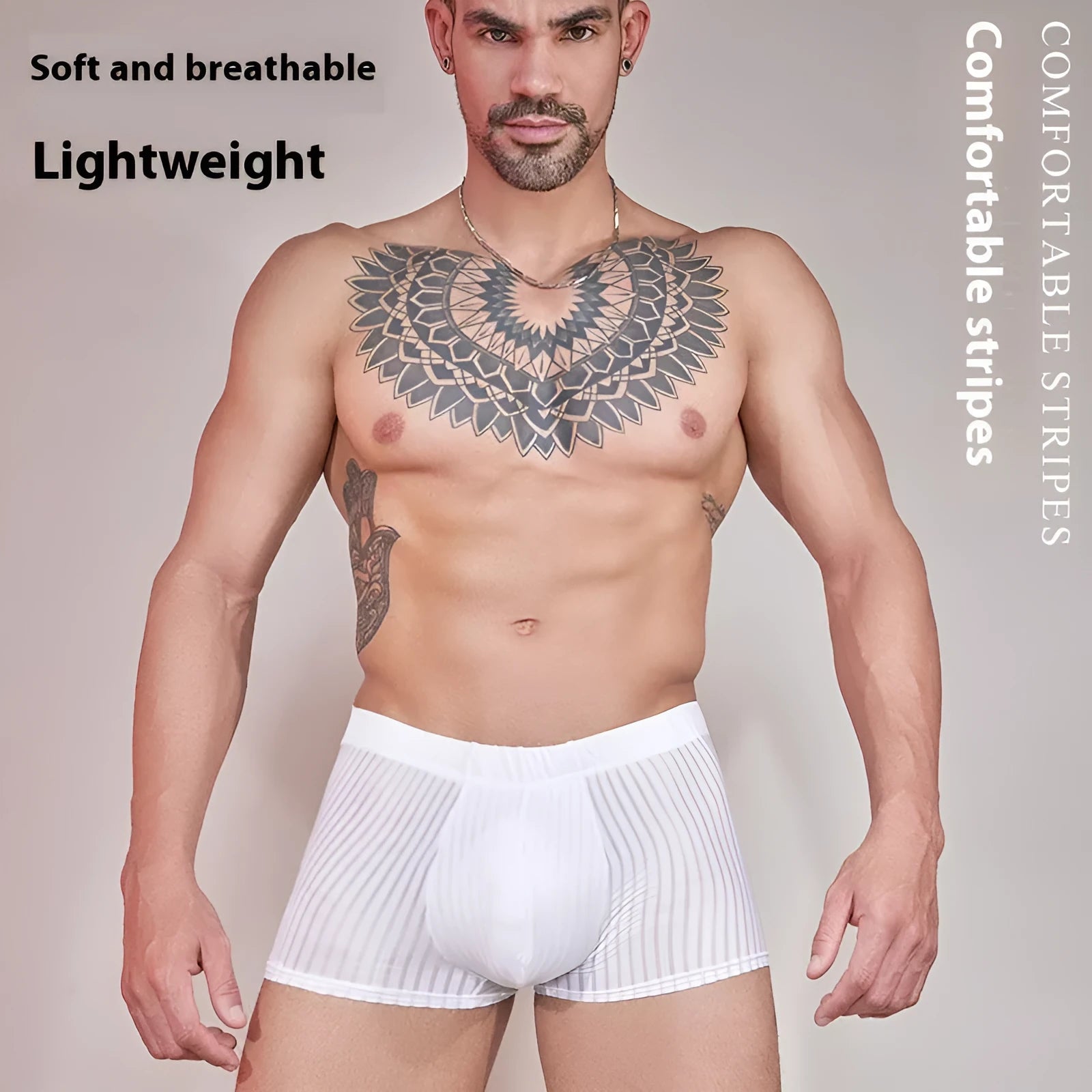 Men's black and white striped low-rise nylon briefs on a flat surface