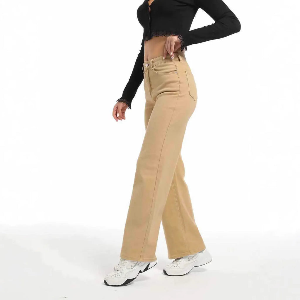 Women's high-waist wide-leg jeans in apricot colour, laid flat to show straight leg cut.