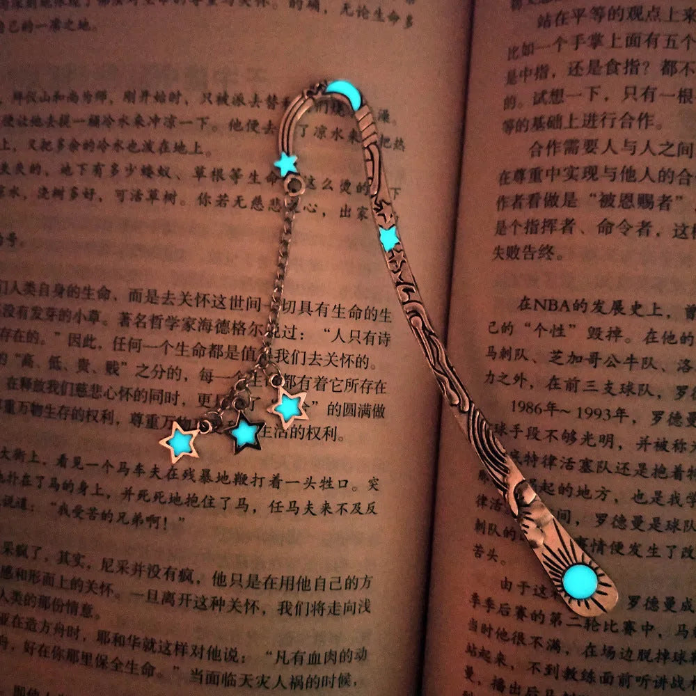 Retro five-pointed star glowing metal bookmark in ancient silver or bronze with sun, moon and stars design