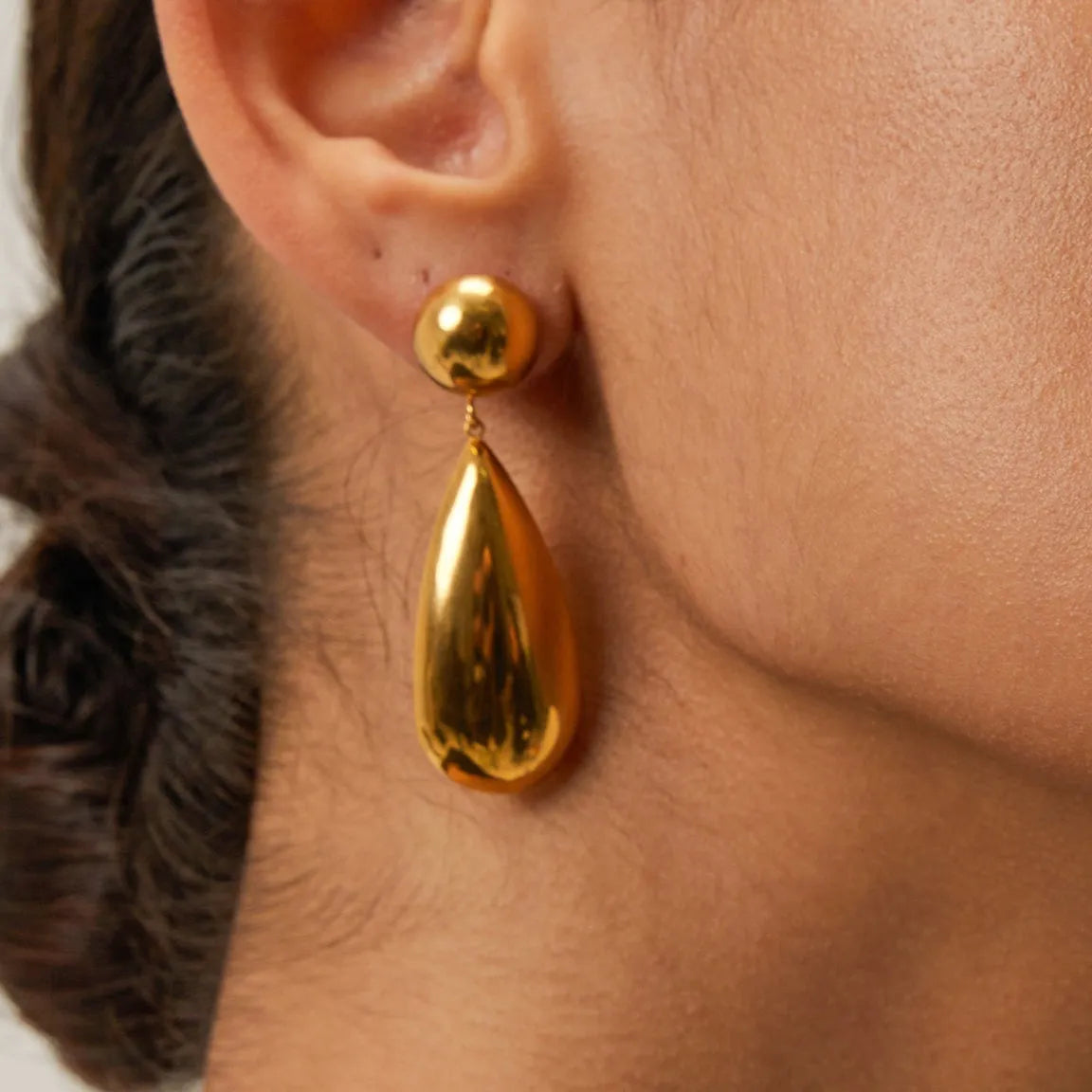 Gold electroplated stainless steel water drop earrings with geometric hemisphere design